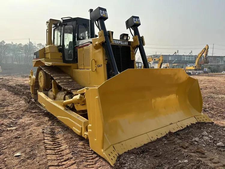 A Universal Blade (U-Blade) bulldozer featuring a curved blade with large side wings